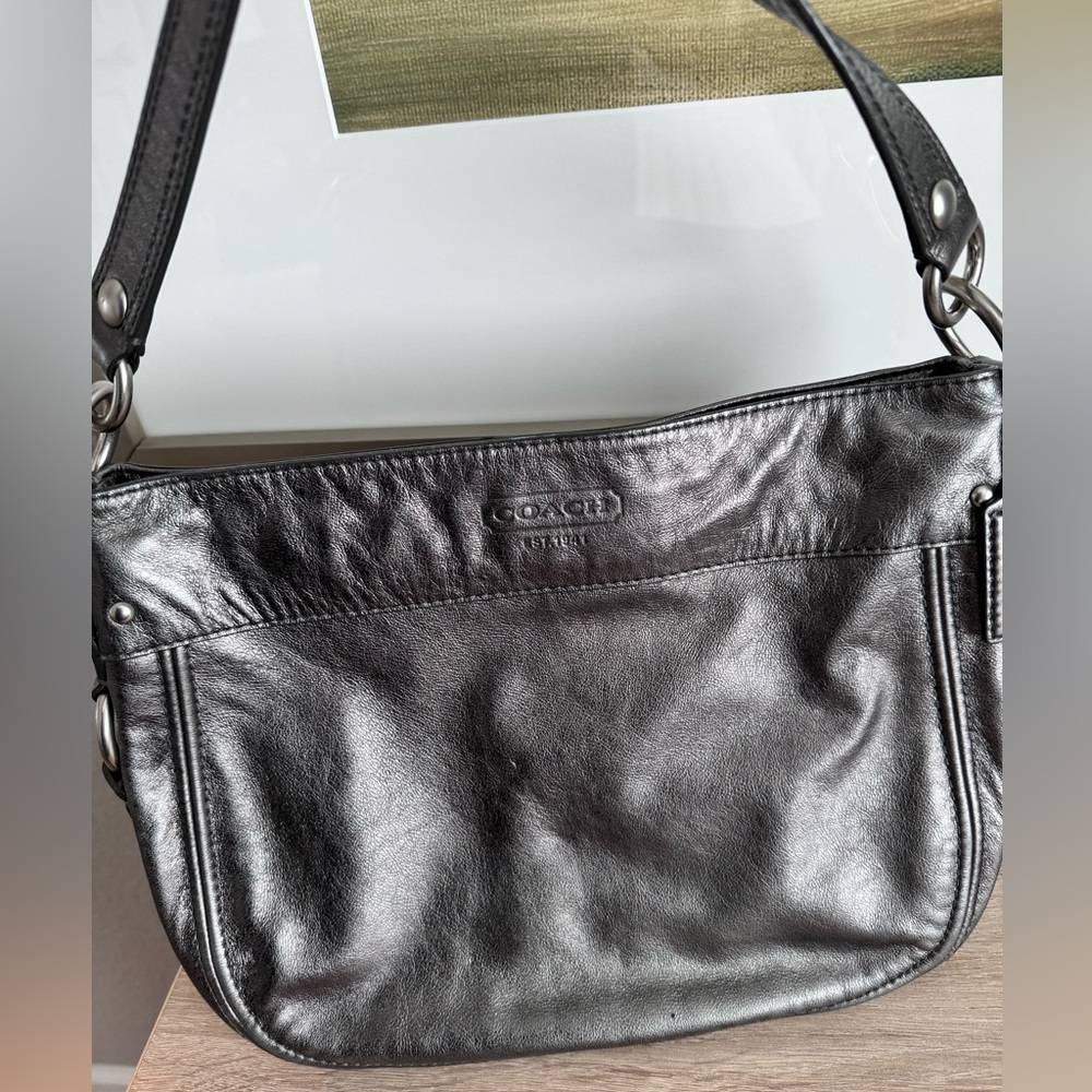 Gunmetal gray leather Coach crossbody bag.